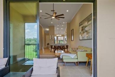 Experience refined living in this elegant second-floor residence on Esplanade Golf and Country at Lakewood Ranch in Florida - for sale on GolfHomes.com, golf home, golf lot