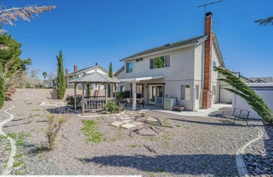 Prepare to be captivated by this charming two-story gem nestled on Rancho Vista Golf Course in California - for sale on GolfHomes.com, golf home, golf lot