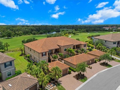 Experience refined living in this elegant second-floor residence on Esplanade Golf and Country at Lakewood Ranch in Florida - for sale on GolfHomes.com, golf home, golf lot