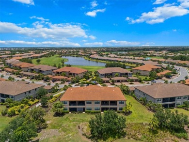 Experience refined living in this elegant second-floor residence on Esplanade Golf and Country at Lakewood Ranch in Florida - for sale on GolfHomes.com, golf home, golf lot