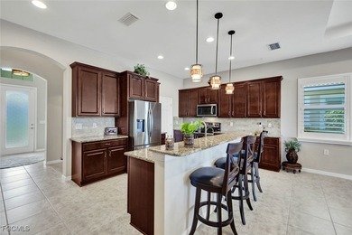 Immaculate lakefront San Remo floor plan home built by WCI on Pelican Preserve Golf Club in Florida - for sale on GolfHomes.com, golf home, golf lot