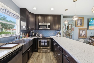 Absolutely stunning, fully updated ground-floor corner villa on Kings Point Golf -Flanders Way in Florida - for sale on GolfHomes.com, golf home, golf lot