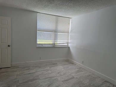 This well-maintained first-floor unit offers a great combination on Pine Island Ridge Country Club in Florida - for sale on GolfHomes.com, golf home, golf lot