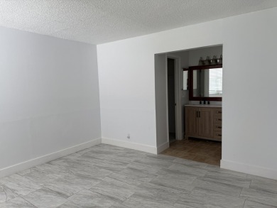 This well-maintained first-floor unit offers a great combination on Pine Island Ridge Country Club in Florida - for sale on GolfHomes.com, golf home, golf lot