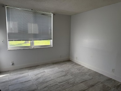This well-maintained first-floor unit offers a great combination on Pine Island Ridge Country Club in Florida - for sale on GolfHomes.com, golf home, golf lot
