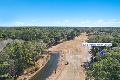 Welcome to 3056 Purple Finch Ln SW. Tucked away on a quiet on Lockwood Folly Country Club in North Carolina - for sale on GolfHomes.com, golf home, golf lot