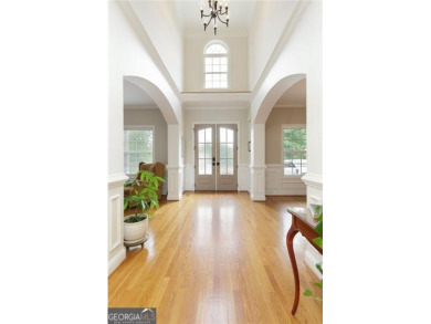 This custom-built home sits on a roundabout cul-de-sac nestled on Hampton Golf Village in Georgia - for sale on GolfHomes.com, golf home, golf lot