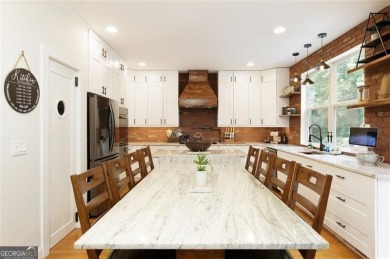 This custom-built home sits on a roundabout cul-de-sac nestled on Hampton Golf Village in Georgia - for sale on GolfHomes.com, golf home, golf lot