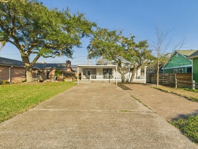 Updated home with large living spaces and a huge covered porch on Rockport Country Club in Texas - for sale on GolfHomes.com, golf home, golf lot