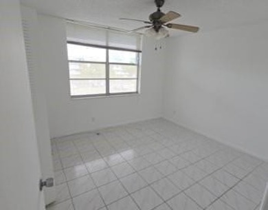 Spacious and bright 2-bed, 2-bath + den/office condo in Palm on Oriole Golf and Tennis Club in Florida - for sale on GolfHomes.com, golf home, golf lot