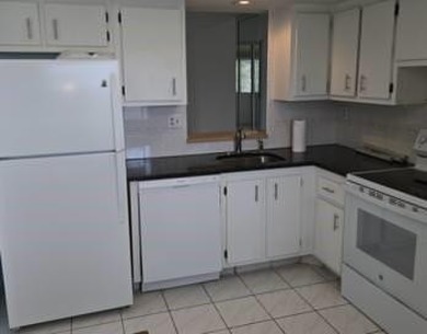 Spacious and bright 2-bed, 2-bath + den/office condo in Palm on Oriole Golf and Tennis Club in Florida - for sale on GolfHomes.com, golf home, golf lot