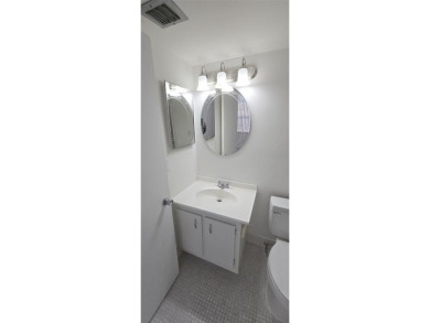 Spacious and bright 2-bed, 2-bath + den/office condo in Palm on Oriole Golf and Tennis Club in Florida - for sale on GolfHomes.com, golf home, golf lot