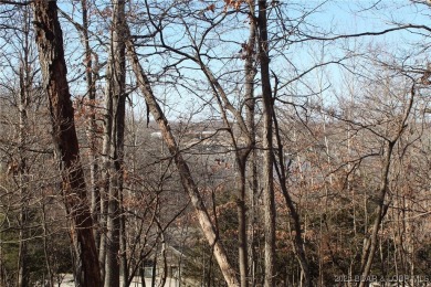 This property features 2 combined lots, creating a spacious on The Club At Porto Cima in Missouri - for sale on GolfHomes.com, golf home, golf lot