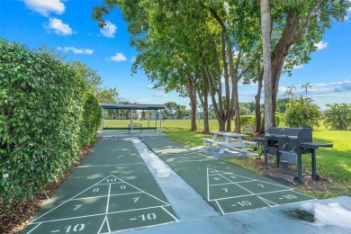 Spacious and bright 2-bed, 2-bath + den/office condo in Palm on Oriole Golf and Tennis Club in Florida - for sale on GolfHomes.com, golf home, golf lot