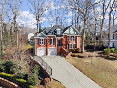 This stunning 4BD/3.5BA home is beautifully updated in the on Towne Lake Hills Golf Club in Georgia - for sale on GolfHomes.com, golf home, golf lot