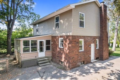 Spacious and updated, this 5-bedroom, 2-bathroom home offers 2 on IMA Brookwood Golf Course in Michigan - for sale on GolfHomes.com, golf home, golf lot