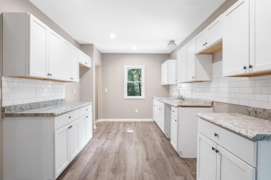 Spacious and updated, this 5-bedroom, 2-bathroom home offers 2 on IMA Brookwood Golf Course in Michigan - for sale on GolfHomes.com, golf home, golf lot