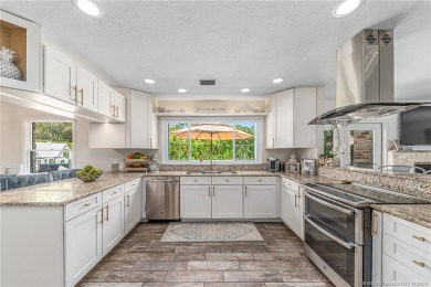 Welcome to this meticulously remodeled 4-bedroom, 3-bathroom on Yacht and Country Club in Florida - for sale on GolfHomes.com, golf home, golf lot