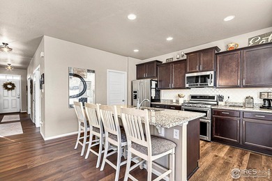 Welcome home to this beautifully maintained 2-story in Water on Pelican Lakes Golf and Country Club in Colorado - for sale on GolfHomes.com, golf home, golf lot