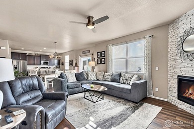 Welcome home to this beautifully maintained 2-story in Water on Pelican Lakes Golf and Country Club in Colorado - for sale on GolfHomes.com, golf home, golf lot