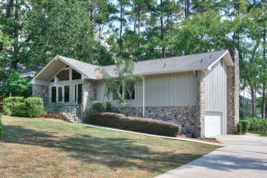 This contemporary stone and cedar West Lake home is nestled on a on West Lake Country Club in Georgia - for sale on GolfHomes.com, golf home, golf lot