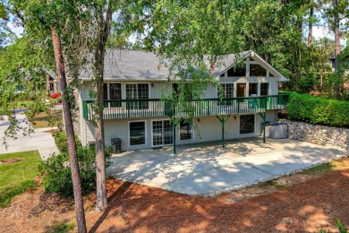 This contemporary stone and cedar West Lake home is nestled on a on West Lake Country Club in Georgia - for sale on GolfHomes.com, golf home, golf lot