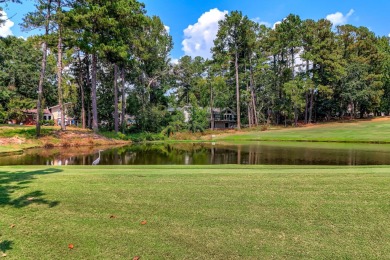This contemporary stone and cedar West Lake home is nestled on a on West Lake Country Club in Georgia - for sale on GolfHomes.com, golf home, golf lot