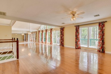This contemporary stone and cedar West Lake home is nestled on a on West Lake Country Club in Georgia - for sale on GolfHomes.com, golf home, golf lot