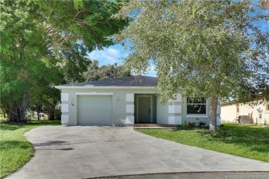 Charming concrete block home in the 55+ community of Spanish on Spanish Lakes I in Florida - for sale on GolfHomes.com, golf home, golf lot