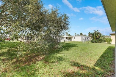 Charming concrete block home in the 55+ community of Spanish on Spanish Lakes I in Florida - for sale on GolfHomes.com, golf home, golf lot