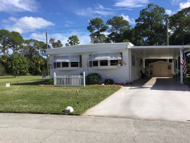 Nicely maintained home backing to a nature preserve.  This home on Spanish Lakes I in Florida - for sale on GolfHomes.com, golf home, golf lot