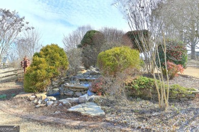 Welcome Home to this beautiful, easy-living residence perfectly on Hampton Golf Village in Georgia - for sale on GolfHomes.com, golf home, golf lot