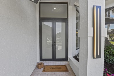 Exquisite, fully upgraded residence nestled within the on Stonebridge Golf and Country Club in Florida - for sale on GolfHomes.com, golf home, golf lot