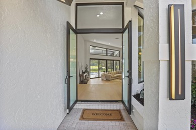 Exquisite, fully upgraded residence nestled within the on Stonebridge Golf and Country Club in Florida - for sale on GolfHomes.com, golf home, golf lot