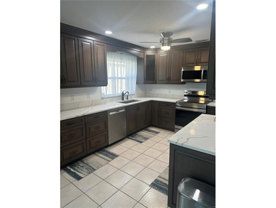 Rare Opportunity: Stunning Remodeled Sheffield in Gated Kings on Kings Gate Golf Club in Florida - for sale on GolfHomes.com, golf home, golf lot