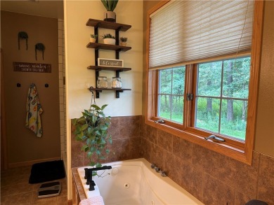 Discover this gem with everything you could wish for. Located on on Spider Lake Golf Resort in Wisconsin - for sale on GolfHomes.com, golf home, golf lot