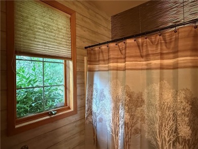 Discover this gem with everything you could wish for. Located on on Spider Lake Golf Resort in Wisconsin - for sale on GolfHomes.com, golf home, golf lot