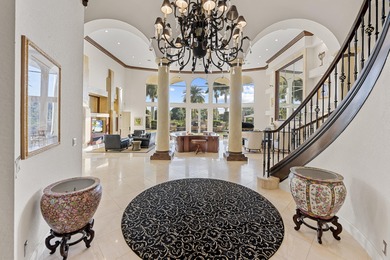 Masterfully designed, this exclusive Boca Grove estate rests on on Boca Grove Golf and Tennis in Florida - for sale on GolfHomes.com, golf home, golf lot
