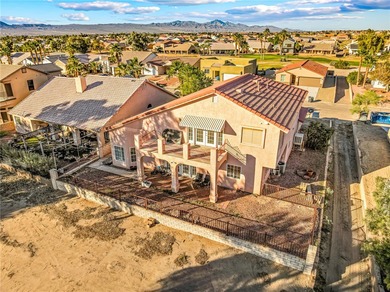 PRICED TO SELL! Stunning two-story home backing Desert Lakes on Desert Lakes Golf Course in Arizona - for sale on GolfHomes.com, golf home, golf lot