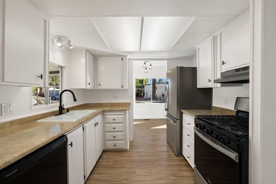 This fully renovated manufactured home is now available for sale on Date Palm Country Club in California - for sale on GolfHomes.com, golf home, golf lot