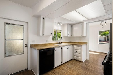 This fully renovated manufactured home is now available for sale on Date Palm Country Club in California - for sale on GolfHomes.com, golf home, golf lot