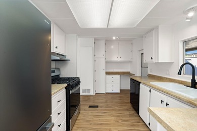 This fully renovated manufactured home is now available for sale on Date Palm Country Club in California - for sale on GolfHomes.com, golf home, golf lot