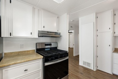 This fully renovated manufactured home is now available for sale on Date Palm Country Club in California - for sale on GolfHomes.com, golf home, golf lot