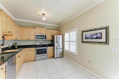 Discover the charm and convenience of this delightful two-story on University Park Country Club in Florida - for sale on GolfHomes.com, golf home, golf lot