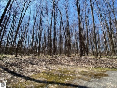 Towering hardwoods in a quiet cul-de-sac location and a large on Cedar River Golf Course in Michigan - for sale on GolfHomes.com, golf home, golf lot