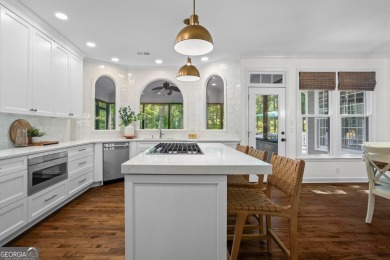 Nestled in the heart of Alpharetta this renovated home in on The Golf Club of Georgia in Georgia - for sale on GolfHomes.com, golf home, golf lot