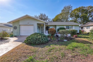 This elegant home features stunning hardwood floors throughout on Highland Lakes Executive Golf Course in Florida - for sale on GolfHomes.com, golf home, golf lot