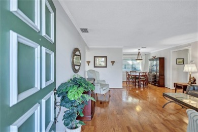 This elegant home features stunning hardwood floors throughout on Highland Lakes Executive Golf Course in Florida - for sale on GolfHomes.com, golf home, golf lot