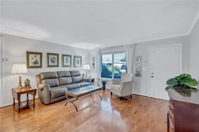 This elegant home features stunning hardwood floors throughout on Highland Lakes Executive Golf Course in Florida - for sale on GolfHomes.com, golf home, golf lot