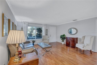 This elegant home features stunning hardwood floors throughout on Highland Lakes Executive Golf Course in Florida - for sale on GolfHomes.com, golf home, golf lot